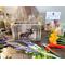 A wood moose box made with upcycled gray wood. It is shown on my work table surrounded by cut faux wildflowers. 
